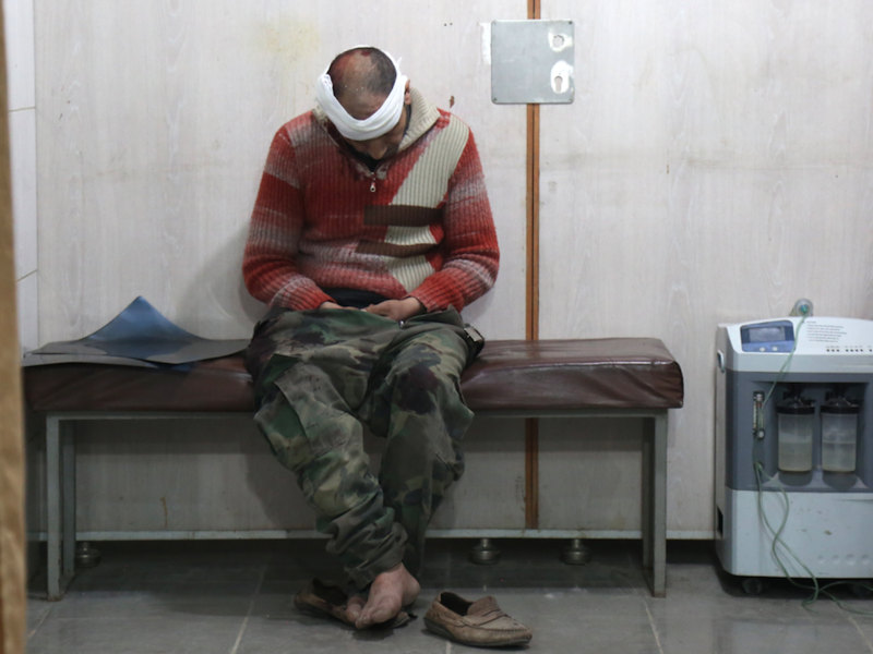 A Syrian man waits to receive treatment at a make-shift hospital in Kafr Batna following government air strikes on the town of Jisreen, in the besieged Eastern Ghouta region on Feb. 19, 2018. 
(Ammar SULEIMAN / AFP)