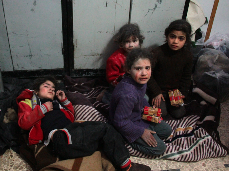 Syrian children cry at a make-shift hospital in Douma following air strikes on the Syrian village of Mesraba in the besieged Eastern Ghouta region on the outskirts of the capital Damascus, on Feb. 19, 2018. 
(Hamza Al-Ajweh / AFP)