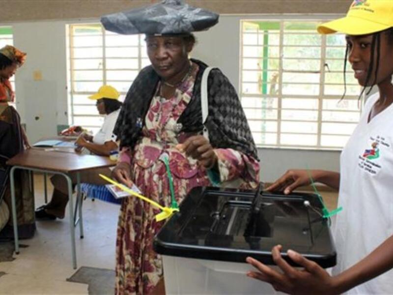 An Oshiherero woman casts her vote at a polling station in Windhoek. About 1.18 million voters are registered to vote for regional councillors in 107 constituencies in 13 political regions. The elections cost about 120 million Namibia dollars (12,457 euros and 16,615 US dollars).