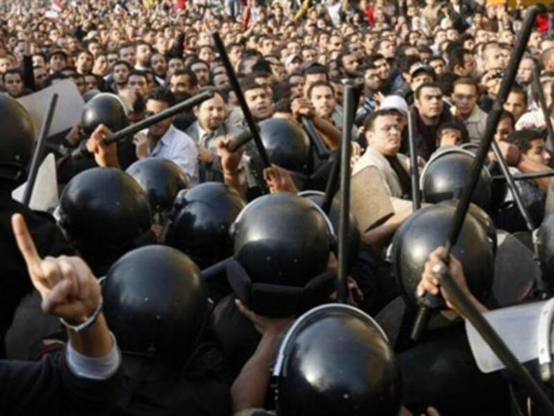 Egyptian demonstrators clash with the Egyptian police.