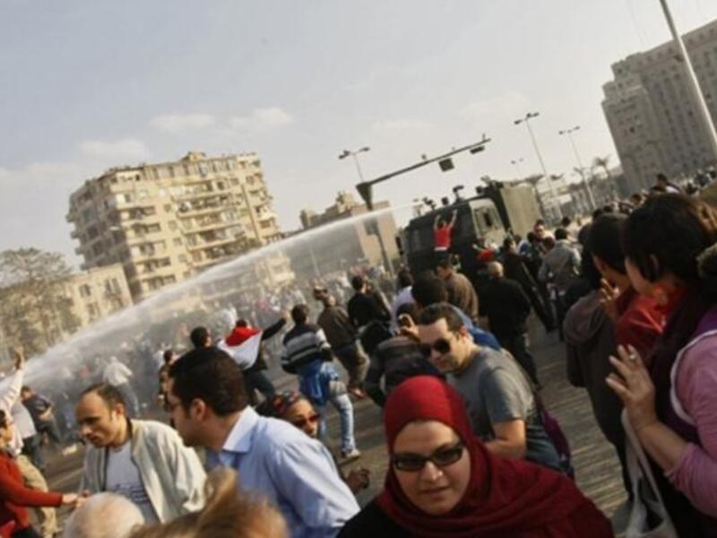 Egyptian police use water canon to disperse demonstrators during clashes in central Cairo.