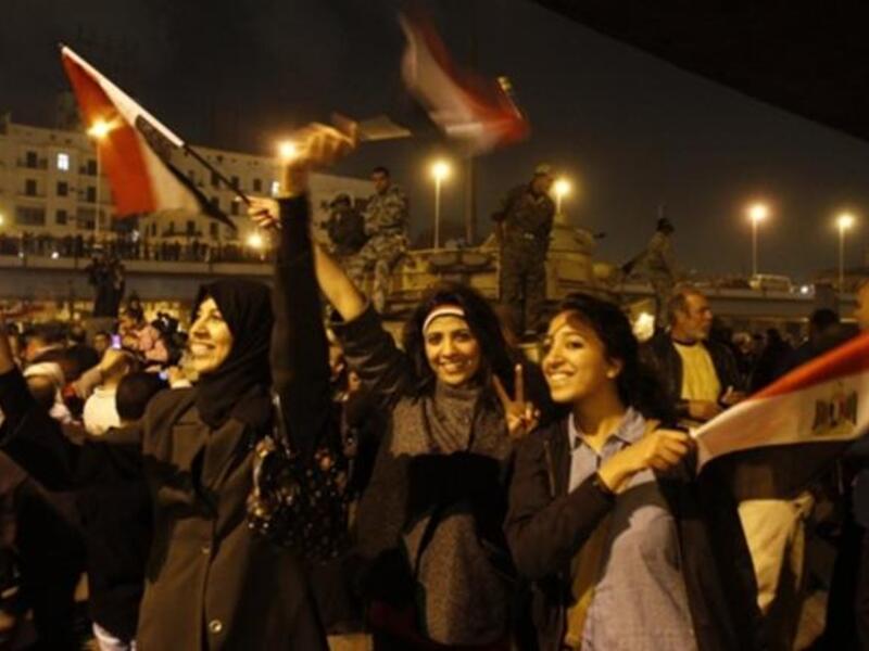 Egyptians celebrate the ousting of Mubarak in Cairo on the night of Friday, February 11, 2011