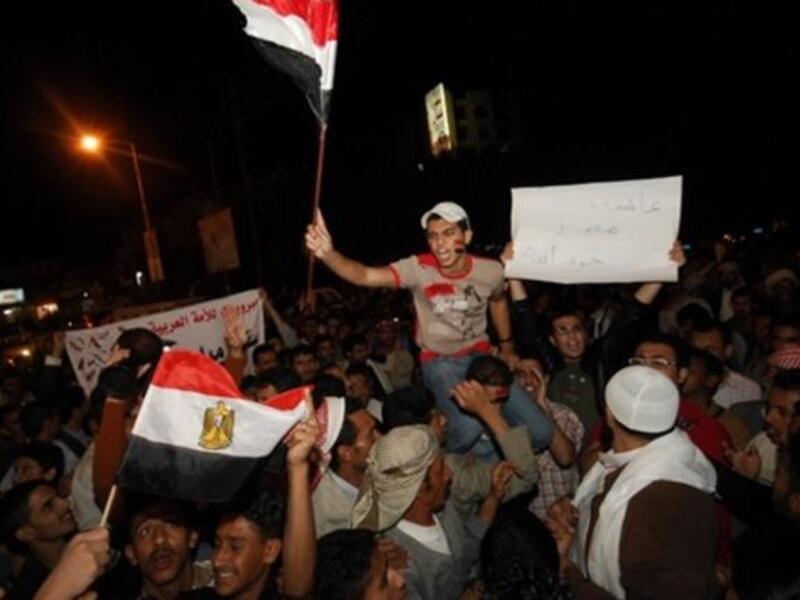 Yemenis Yell outside the Egyptian Embassy in Sana'a in commemoration of a crashing fall following a 30-year regime. 