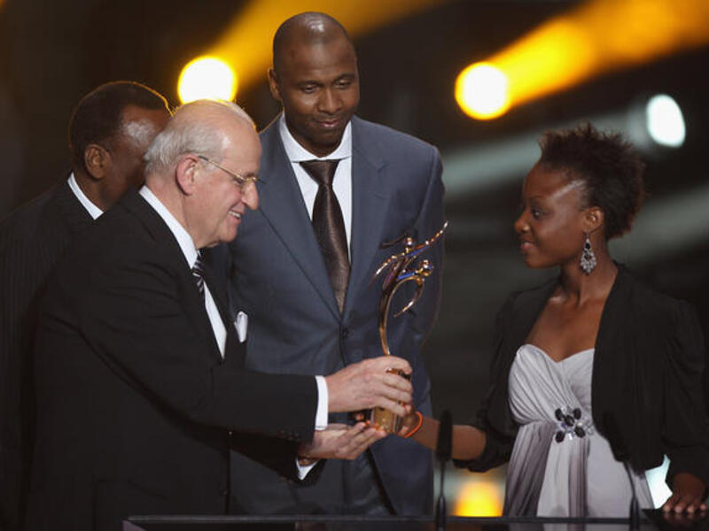 Jean-Francois Hayana (R) captain of the Haiti women's U17's team receives the Fifa Fair Play award.
