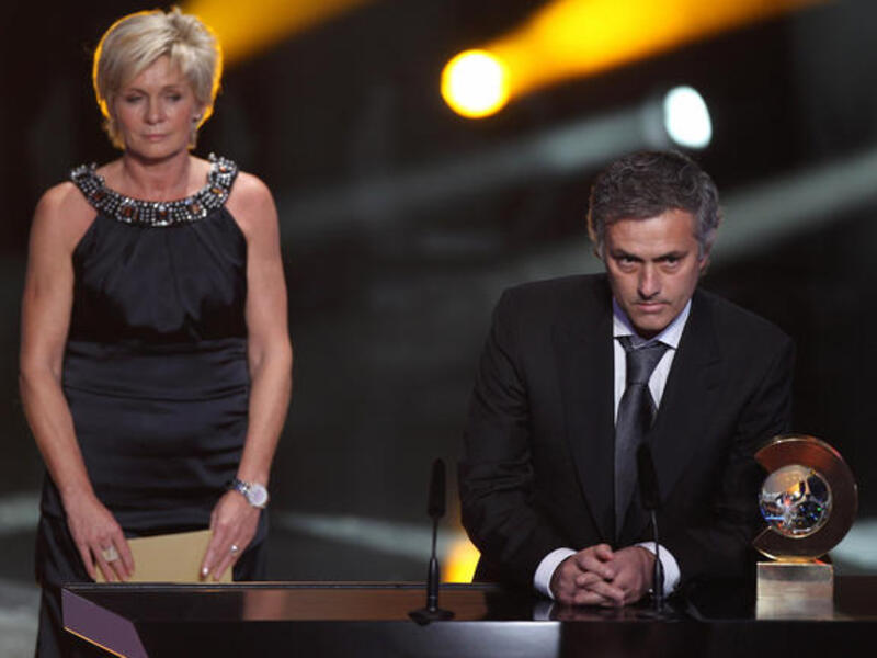 Jose Mourinho (R) of Portugal receives the coach of the year award alongside Silvia Neid of Germany winner of the women's coach of the year award.