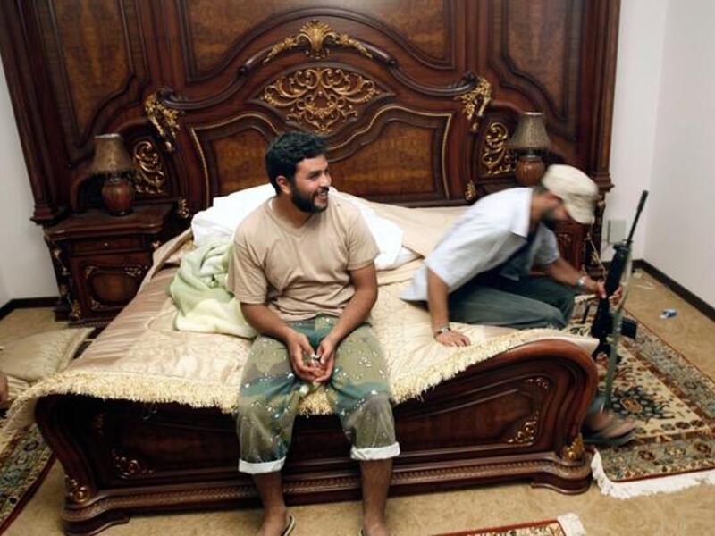 Father Gaddafi's very own rustic retreat: Here, images of his farm house. A nomadic tribesman at heart, he was Lord of the
Manor when it took his fancy, and would switch between city palace, country villa, and desert-side tent, according to whim.
