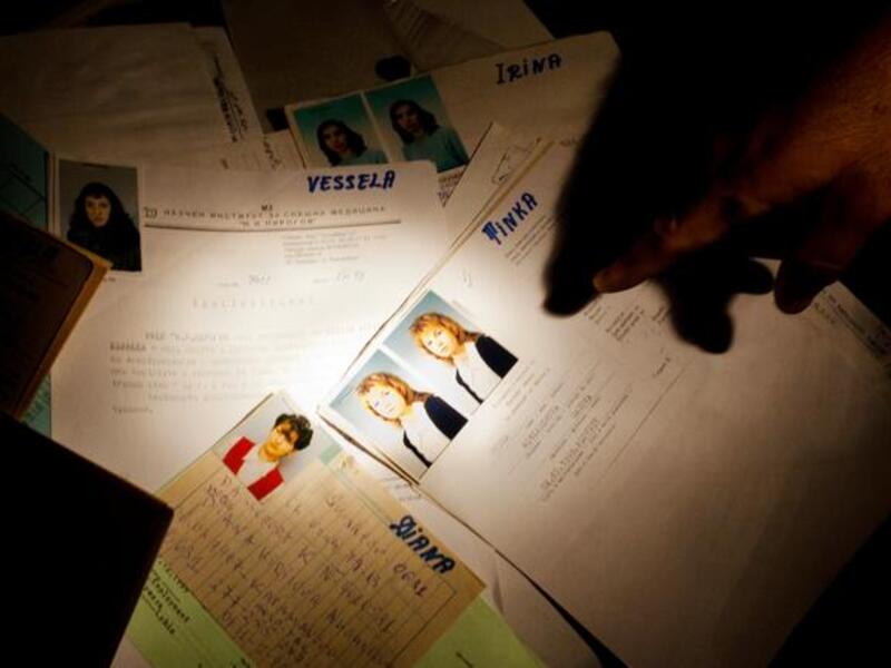 Medical leaks: What once private, now open to public gaze. Rebels pry through records of medical staff at a private hospital in Gaddafi's main military compound. A symbolic victory spot, 
fast turning tourist attraction, to plunger & pillage. Family portraits are of more interest than medical records, unless those unearthed are of the Gaddafis.
