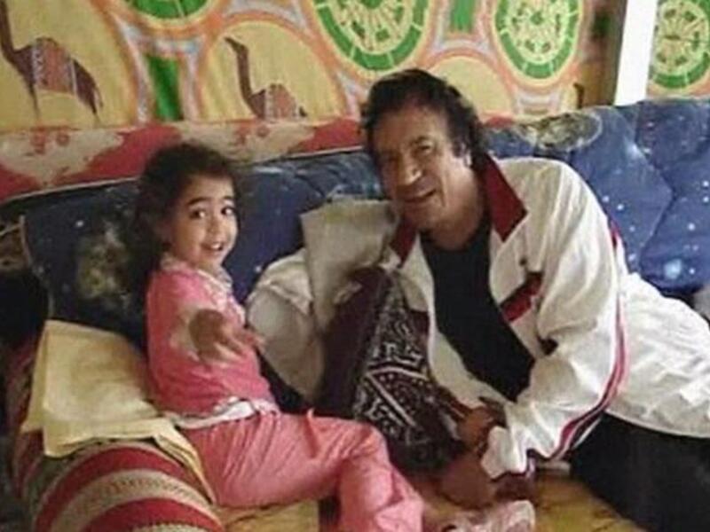 When he's not fawning over Condy Rice, he's canoodling with this grandchildren. Much more befitting, to be sure, for 'good guy' 
Gaddafi promotion, this glimpse of the 
human, (less creepy) side of the Gaddafi 'zenga' man.
