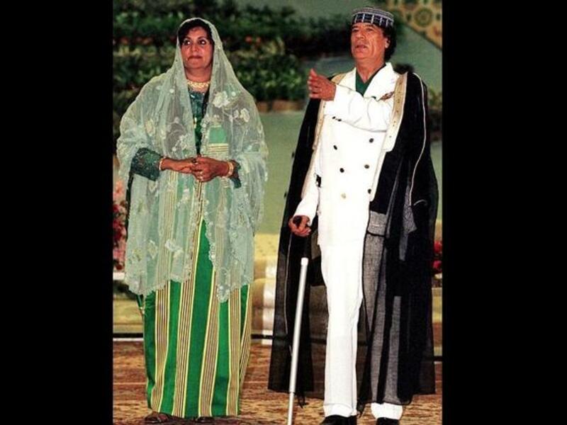 Husband and Wife pose for a Kodak moment, costumed out as always in readiness for the family album. Wife Safia was
last said to be in hiding with three of her children in Algeria.
