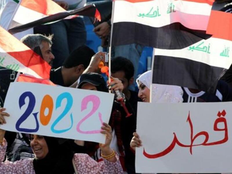 Iraqi football fans show their support to Qatar's bid to host the 2022 World Cup as they attend the 20th Gulf Cup semi-final football match between Iraq and Kuwait in the southern Yemeni city of Aden. Kuwait won on penalty shots after a 2-2 draw.