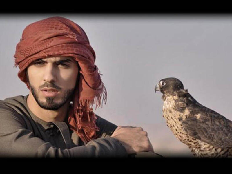 Sorry ladies, looks like Omar’s already got a bird on his arm