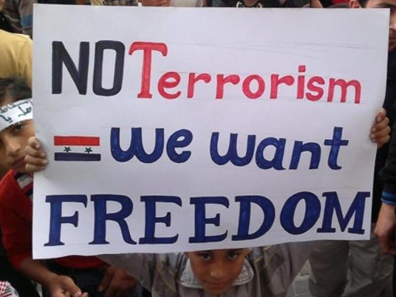 Banias Boy: Other banners witnessed bear the words in Arabic: "Mother, prepare my shroud, the Syrian people aren't cowards" .