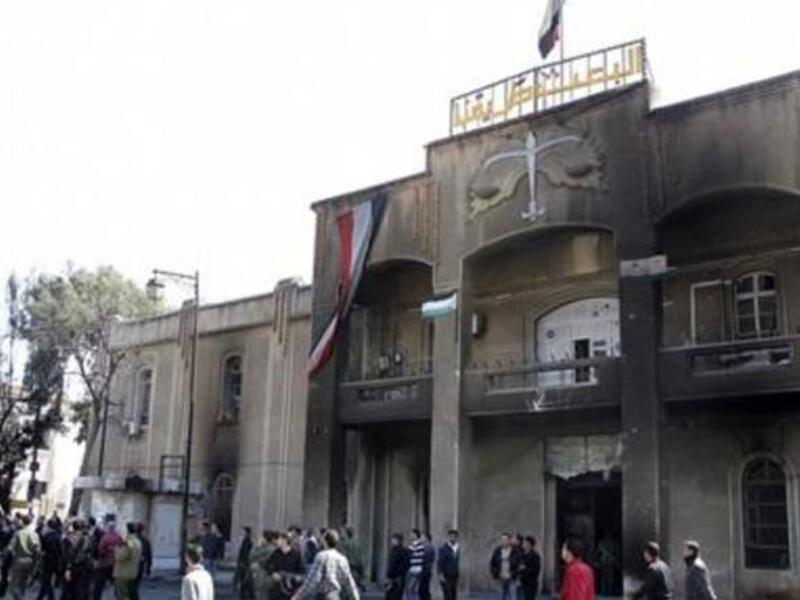 Crowds set fire to the headquarters of the ruling Baath Party in Deraa, chanting "No Baath party, no Assad. We want to liberate the country";  "No, no to emergency law. We are a people infatuated with freedom!"