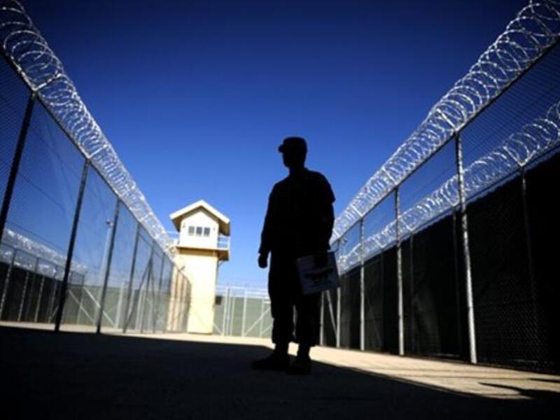 A photo shows a US captain silhouetted at the Bagram prison, north of Kabul, during a media tour. leaked American diplomatic cables revealed that Afghan President Hamid Karzai has ordered the release of numerous dangerous criminals and drug traffickers detained by US-led coalition forces. 