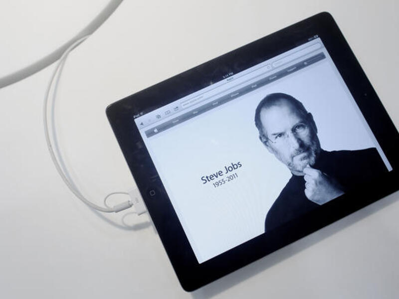 An Apple "iPad 2"-displayed obituary is more fitting a commemoration than an engraved headstone might be. On
hearing of his death, wherever in the world or whatever time zone, fans left flowers in Apple stores as the natural point for paying respects. A reseller in Singapore, Epicenter, literally became center-point for 'Apple Evangelists’.
