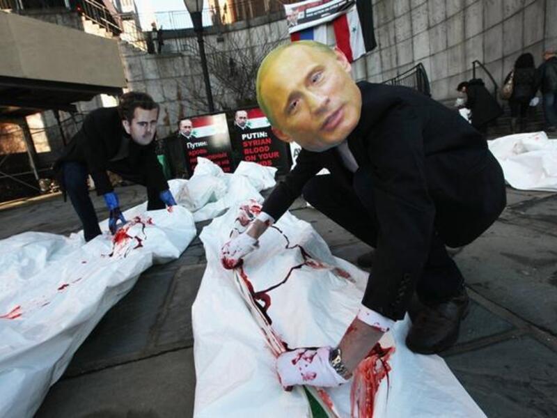 Syria protests with doctored pictures of Putin killing people
