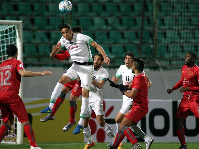 Zobahan's Hadi Mohammadi (C) heads the ball clear during their Asian Champions League (AFC) football match against Qatar's Lekhwiya at the Foolad Shahr Stadium on March 1, 2016, in the Iranian city of Isfahan.
MEHDI ZARE / AFP