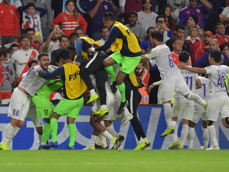 Al Ain's players celebrate after winning the semi final football match of the FIFA Club World Cup 2018 tournament between Argentina's River Plate and Abu Dhabi's Al Ain at the Hazza Bin Zayed Stadium in Abu Dhabi, the capital of the United Arab Emirates, on December 18, 2018.
Giuseppe CACACE / AFP