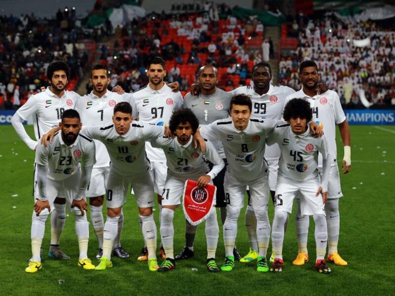UAE's Al-Jazeera starting eleven pose for a team photo prior to the start of their AFC Champions League third round qualifying football match against Qatar's Al-Sadd club at the Mohammed Bin Zayed Stadium in Abu Dhabi on February 9, 2016. 
