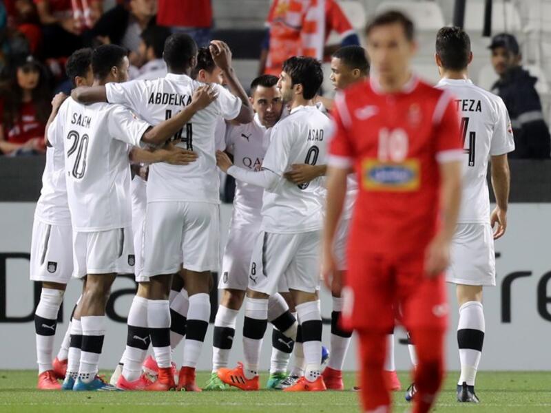 Al-Sadd's players celebrate during the AFC Champions League match al-Sadd vs Persepolis at the Jassim Bin Hamad Stadium in Doha on February 20, 2018.
KARIM JAAFAR / AFP