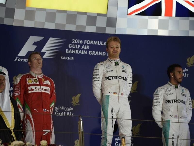 Mercedes AMG Petronas F1 Team's German driver Nico Rosberg (2nd R) celebrates after winning the Bahrain Formula 1 GP next to second placed Ferrari's Finnish driver Kimi Raikkonen (3rd L) and third placed Mercedes AMG Petronas F1 Team's British driver Lewis Hamilton (R) at the Sakhir circuit in Manama on April 3, 2016. AFP PHOTO / MOHAMMED AL-SHAIKH