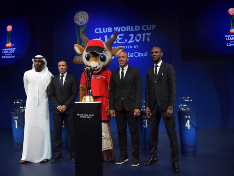 (L to R) FIFA legends Abdulrahim Jumaa, Ivan Cordoba, Mikael Silvestre and Eric Abidal pose for a photo next to the official trophy during the draw of the FIFA Club World Cup UAE 2017 football tournament in Abu Dhabi on October 9, 2017. The tournament will be held in Abu Dhabi and Al-Ain from December 6 to 16.
GIUSEPPE CACACE / AFP