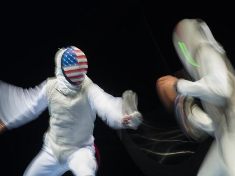 Picture taken with long time exposure shows Race Imboden (L) of the US and Mohamed Essam of Egypt fighting during a qualification duel of the Individual Men's Foil competition at the World Fencing Championships on July 23, 2017 in Leipzig, eastern Germany.
ROBERT MICHAEL / AFP