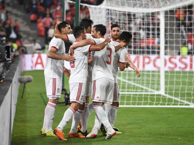 Iran's players celebrate their opening goal during the 2019 AFC Asian Cup quarter-final football match between China and Iran at the Mohammed Bin Zayed Stadium Stadium in Abu Dhabi on January 24, 2019.
Khaled DESOUKI / AFP