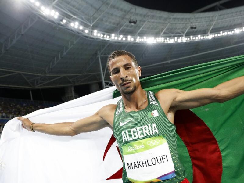 Algeria's Taoufik Makhloufi celebrates winning the silver medal in the Men's 1500m Final during the athletics event at the Rio 2016 Olympic Games at the Olympic Stadium in Rio de Janeiro on August 20, 2016.
Adrian DENNIS / AFP