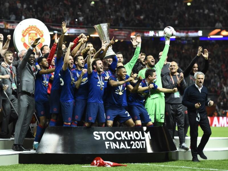 Manchester United's players celebrate with the trophy after winning the UEFA Europa League final football match Ajax Amsterdam v Manchester United on May 24, 2017 at the Friends Arena in Solna outside Stockholm.
Jonathan NACKSTRAND / AFP