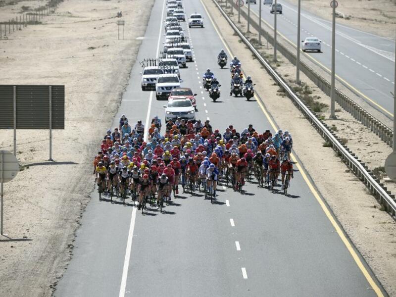 The pack rides on the highway during the second stage of the 2016 Tour of Qatar cycling race, starting and finishing at the Qatar University on February 9, 2016. Norway's Alexander Kristoff won a sprint finish ahead of Britain's Marc Cavendish in the second stage of the Tour of Qatar.