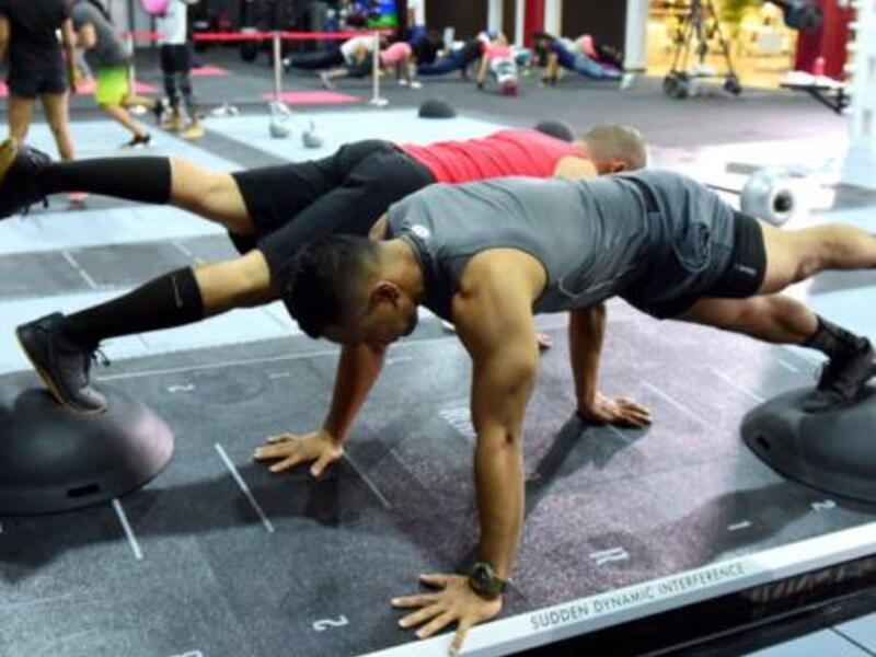 One-legged pushups on top of Bosu balls on the moving REAX Board demands great coordination and balance (Photo: Gulf News)