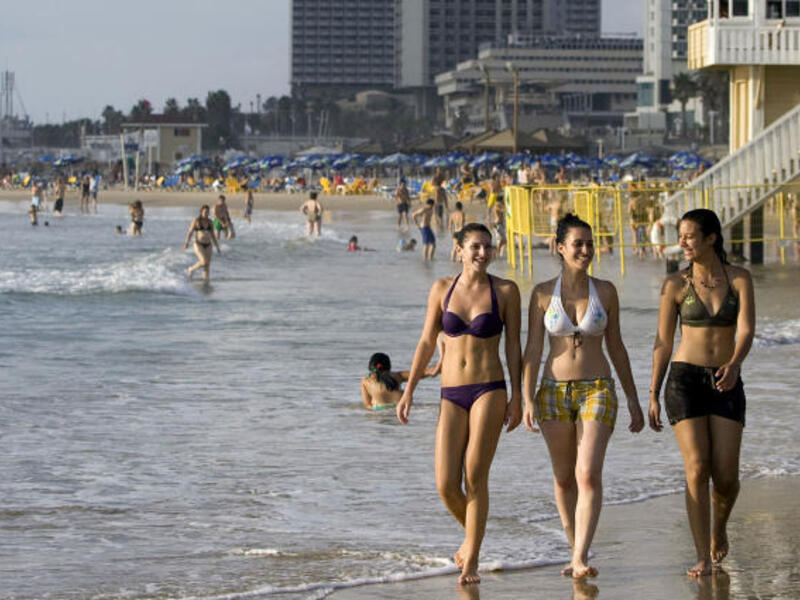 Israeli women enjoy the beach in Tel Aviv.  (AFP/Jonathan Nackstrand)