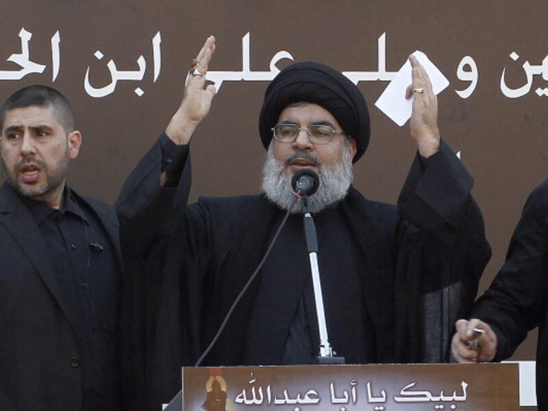 The head of Lebanon's militant Shiite Muslim movement Hezbollah, Hassan Nasrallah gives a speech during a massive Shiite Muslim commemoration in southern Beirut on November 14, 2013. [Getty Images]
