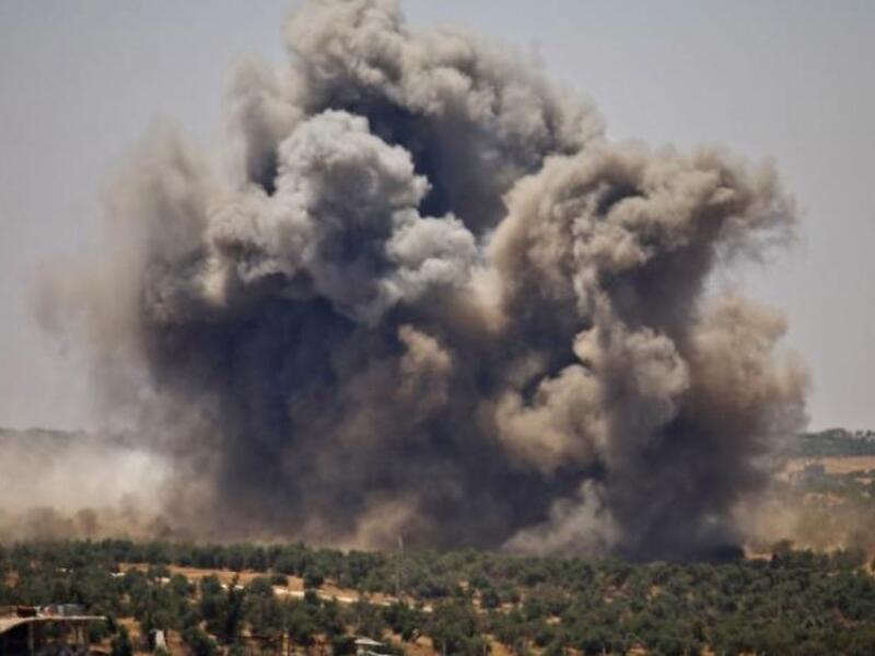 Smoke rises above opposition held areas of Daraa during airstrikes by Syrian regime forces on June 26, 2018. (Mohamad ABAZEED/AFP)