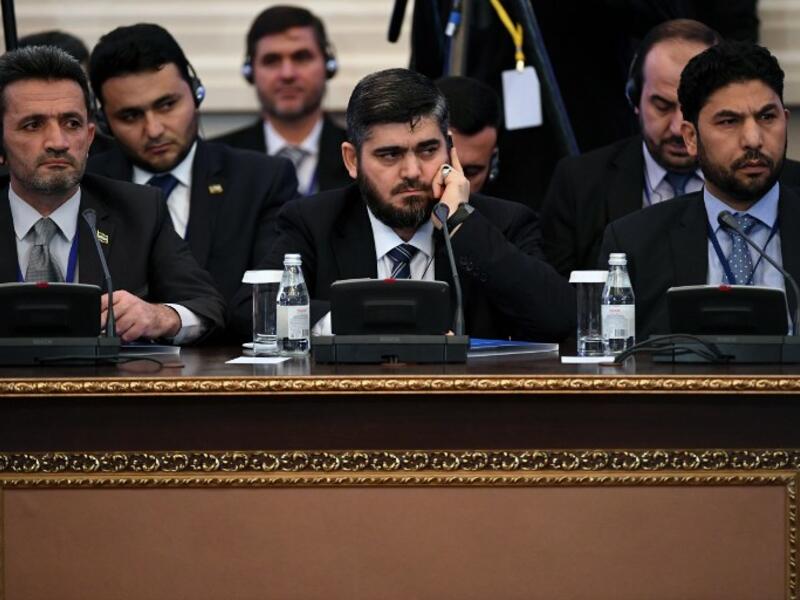 Chief opposition negotiator Mohammad Alloush (C) of the Jaish al-Islam (Army of Islam) rebel group attends the first session of Syria peace talks at Astana's Rixos President Hotel on January 23, 2017. (AFP/Kiril Kudryatsev)