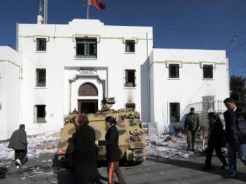 People walk past a government building in Kef, Tunisia. (AFP/File)