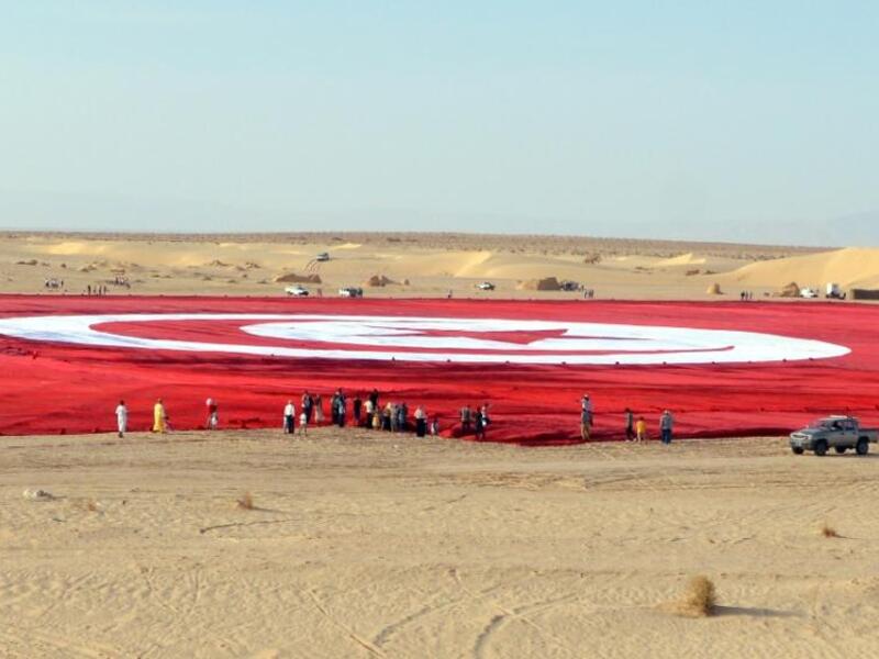 The flag is the size of 19 football pitches.(AFP Photo/Saif Trabelsi)