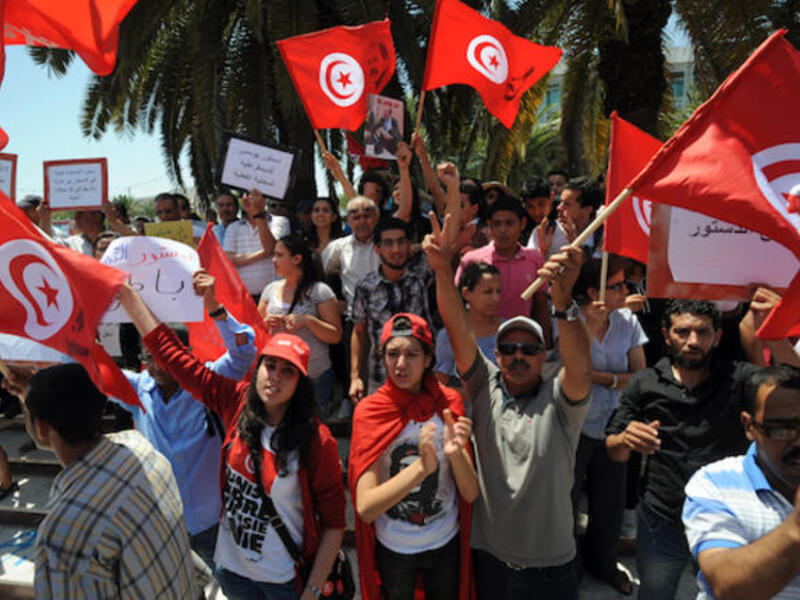 Tunisians shout slogans against the ruling Ennahda Party during a protest in front of the Constituent Assembly (Source: AFP/FETHI BELAID)