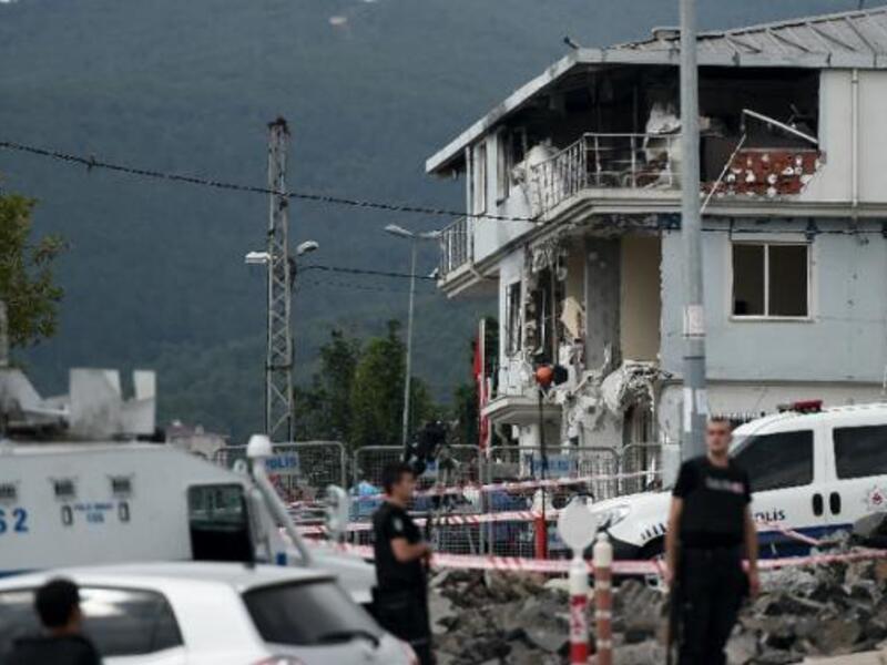 Turkish police officers survey a bombed police station in Istanbul in 2015. (AFP/File)