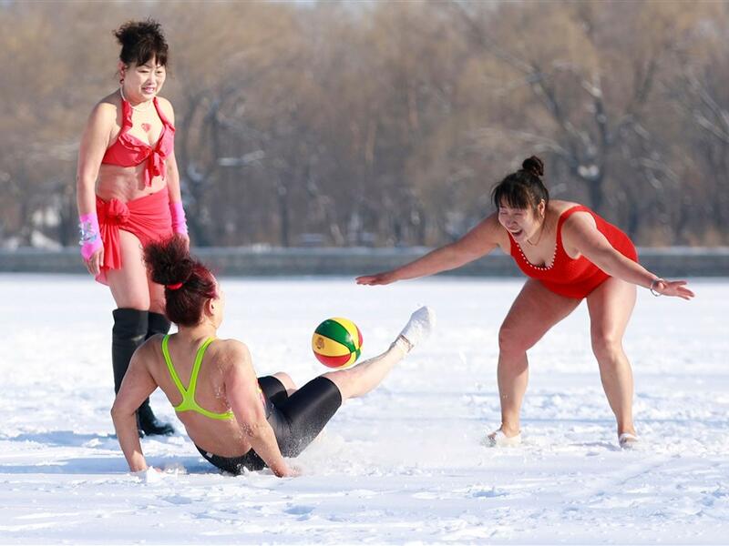 Shenyang, China: Women play in the snow in China's northeastern Liaoning province in celebration of Women's day. (AFP) 
