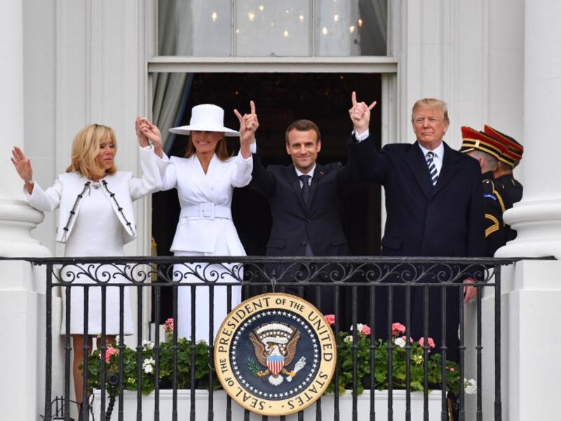 US President Donald Trump (R), French President Emmanuel Macron (2nd R), US First Lady Melana Trump (2nd L) and French First Lady Brigitte Macron are seen on the balcony at the White House in Washington, DC, on April 24, 2018. Nicholas Kamm / AFP