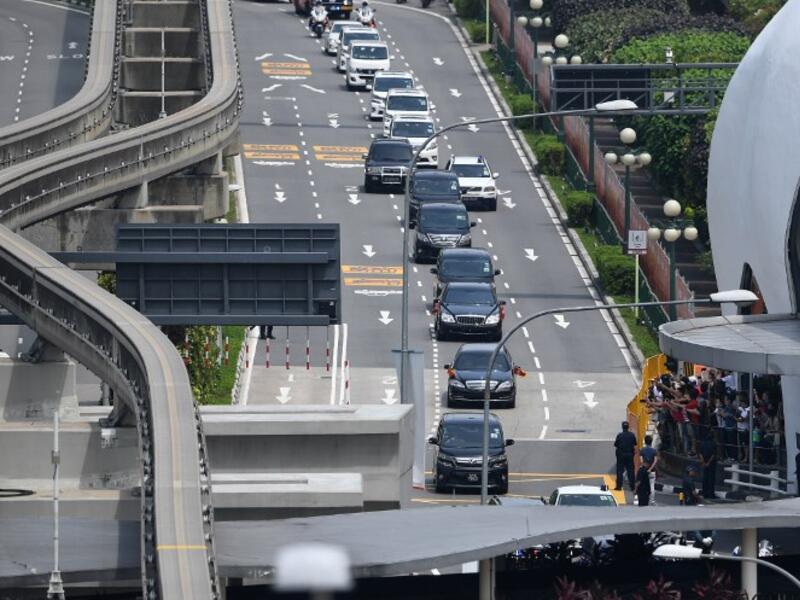 The motorcade (C) transporting North Korea's leader Kim Jong Un leaves Sentosa island after taking part the North Korea-US summit with US President Donald Trump in Singapore on June 12, 2018. (Ted ALJIBE / AFP)