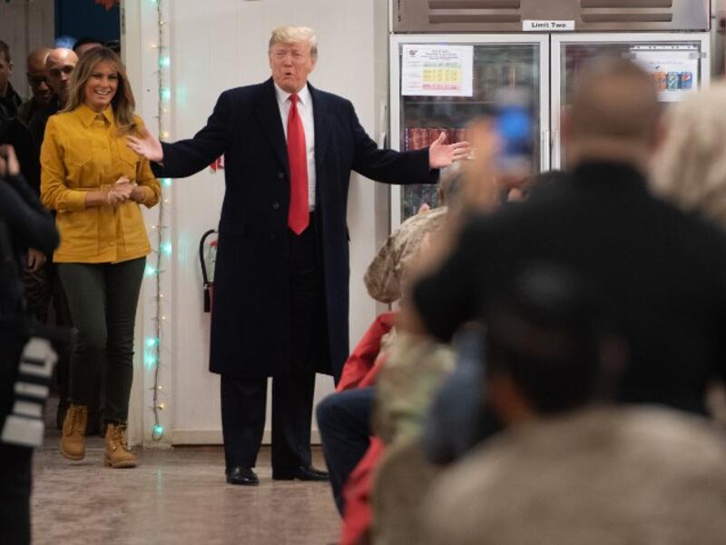 US President Donald Trump and First Lady Melania Trump arrive to visit members of the US military during an unannounced trip to Al Asad Air Base in Iraq on December 26, 2018.
SAUL LOEB / AFP