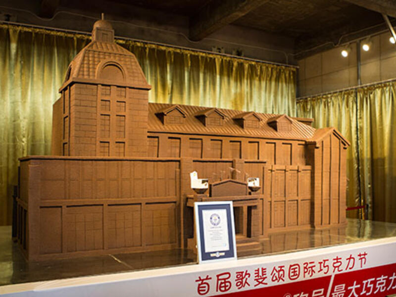 Aficion Chocolate (China) crafted a building 4.08 m long on 30 Sep 2015. Weighing 10,187 kg. This edible edifice outdid the previous record by 1,900 kg. (guinnessworldrecords.com)
