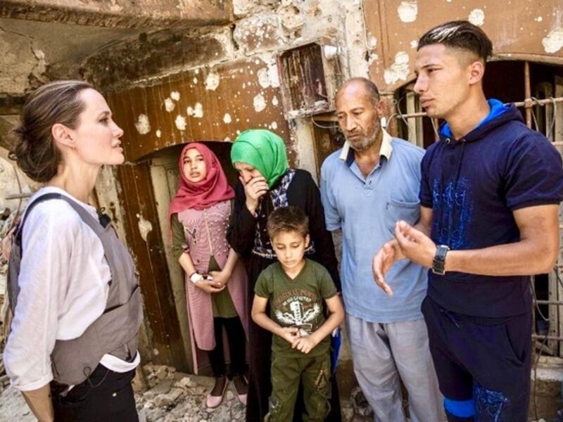 Angelina Jolie meeting with Mohamed and his family during a visit to the Old City in the west of the northern Iraqi city of Mosul, June 16, 2018. (AFP/ File)
