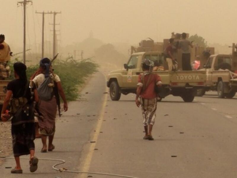 Yemeni pro-government forces gather at the south of Hodeida airport, in Yemen's Hodeida province. (AFP Photo)