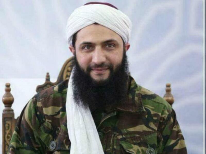 Russia's defense ministry said that the former al-Nusra Front leader lost an arm and is in a "critical condition" following the strike that also killed 12 Hayat Tahrir al-Sham commanders, including Jolani's security chief (AFP/File Photo)
