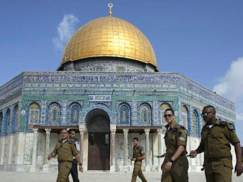 Jerusalem's Aqsa is usually the site of high tension between Israeli security forces and Palestinians, but Friday's video showed a different tension, between Fatah and Hamas. (AFP/File)
