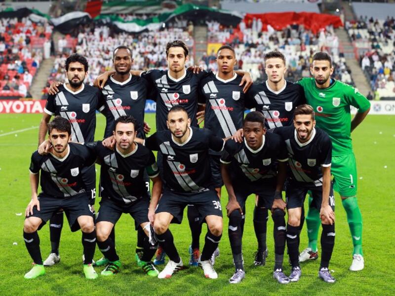Qatar's Al-Sadd starting eleven pose for a team photo prior to the start of their AFC Champions League third round qualifying football match against UAE's Al-Jazeera club at the Mohammed Bin Zayed Stadium in Abu Dhabi on February 9, 2016. 